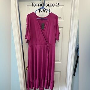 Flowy v-neck plum colored midi dress with tie at waist sleeves to elbows.